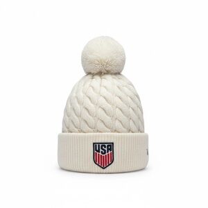 New Era USA Cable Knit Pom Beanie in Cream with Red & Blue Patch